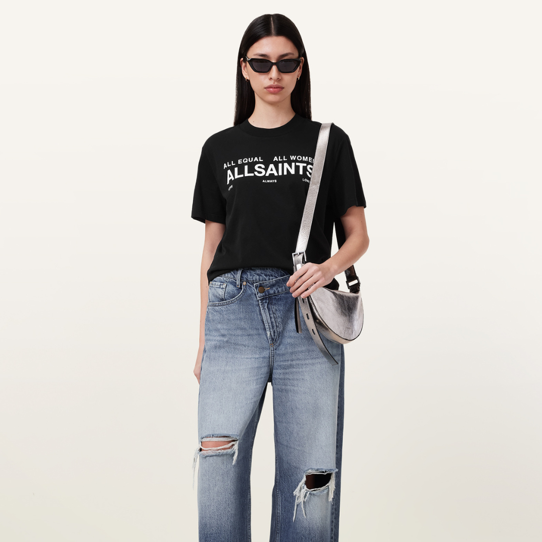 Image of a lady wearing a black and white All Saints T-shirt