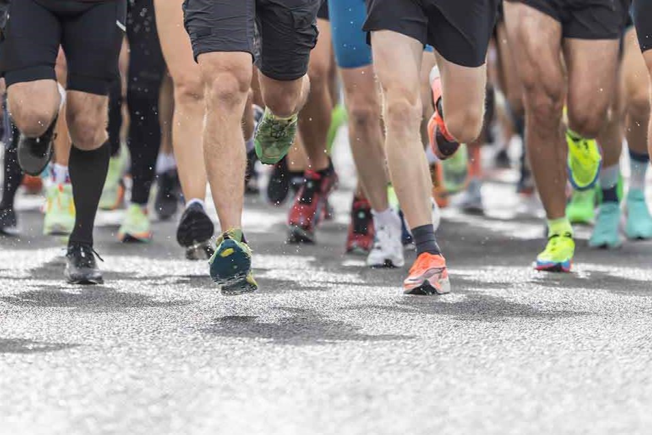 Legs of runners during a race.