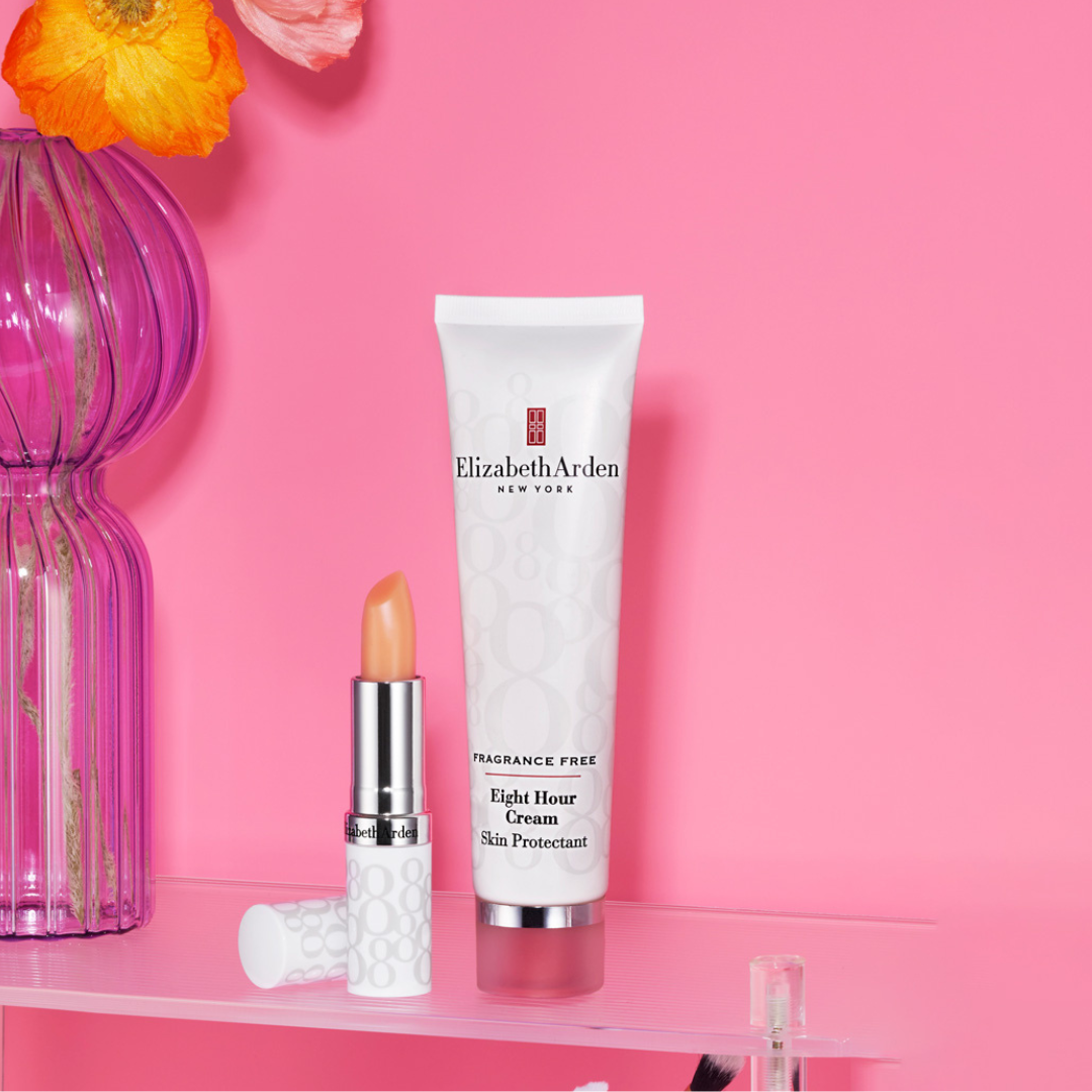 A pink background with an image of a Elizabeth Arden lip protectant stick and an Elizabeth Arden 8 hour cream
